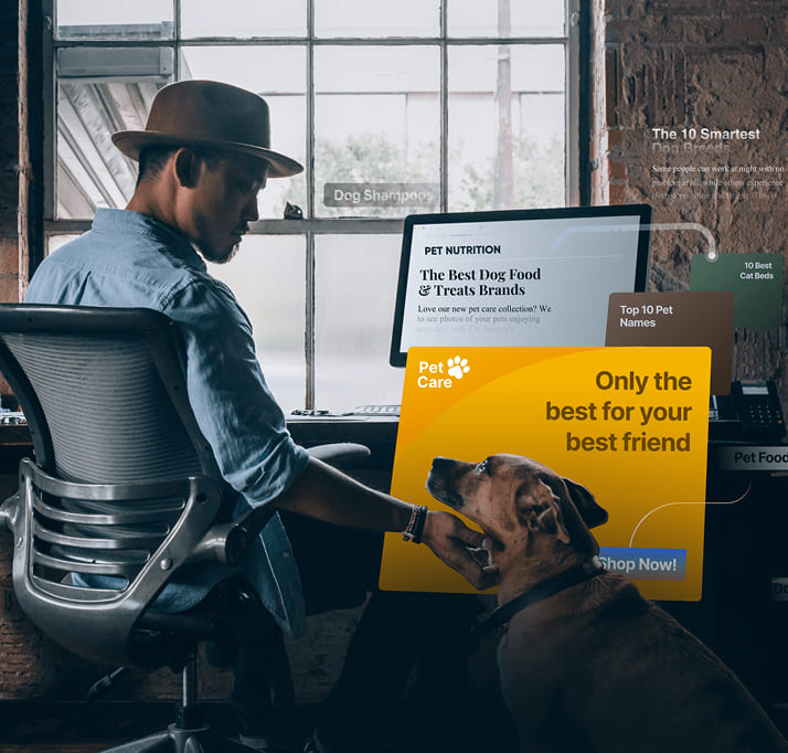 Man pets dog while viewing a pet food article containing contextual ads for pet owners